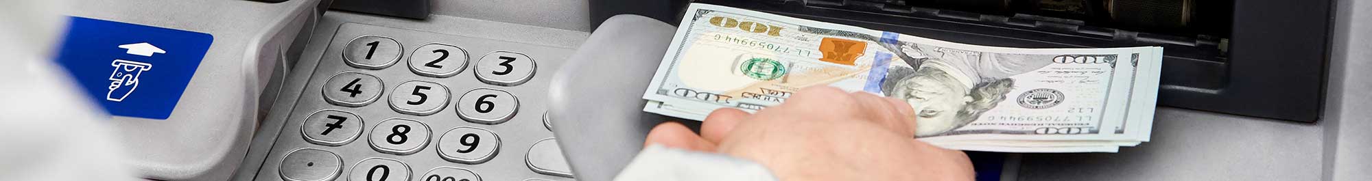 person withdrawing cash at an ATM