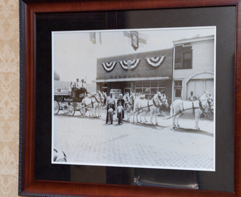 antique photo of Ottawa Illinois street with horse-drawn carriages